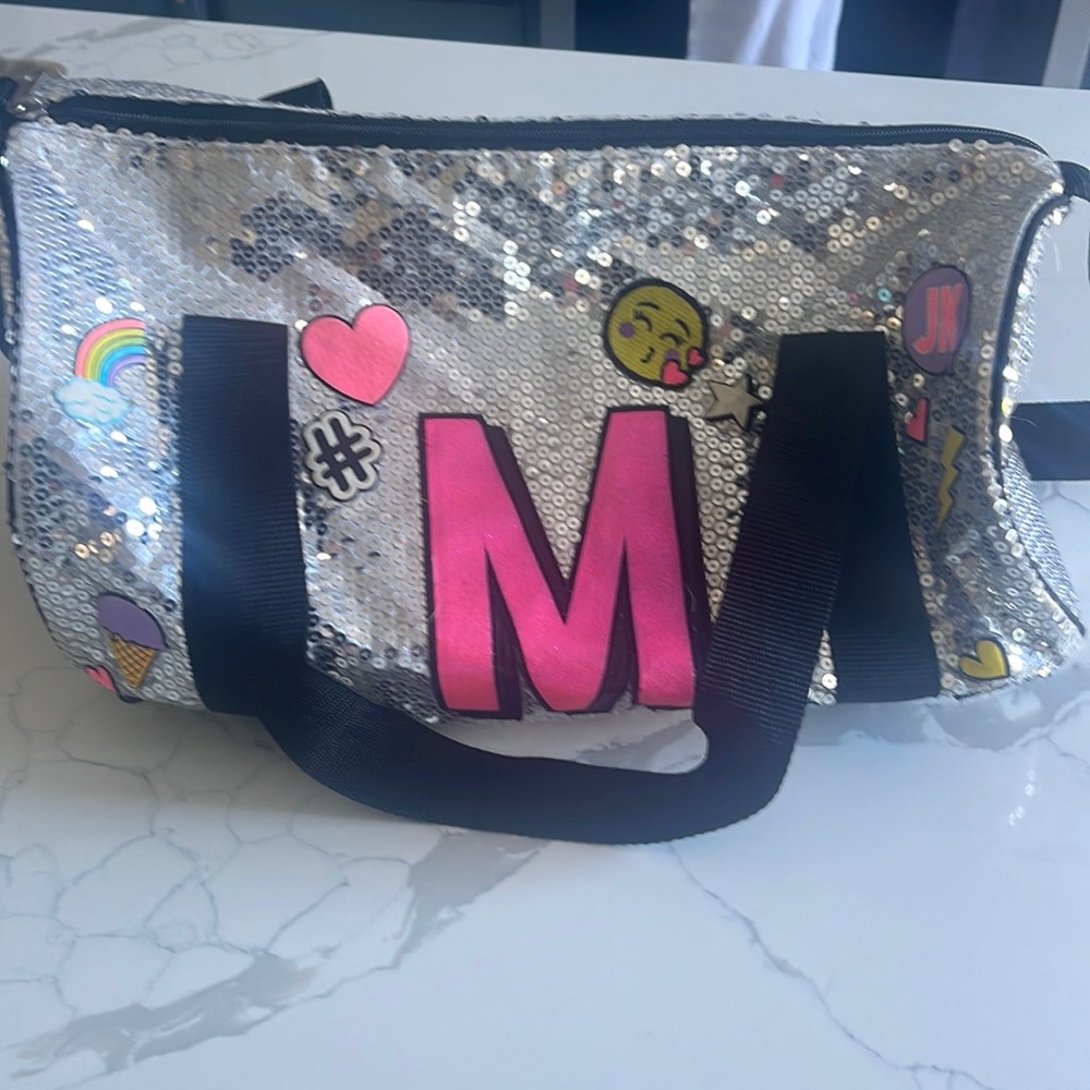 Justice overnight “M” bag